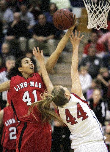 Linn-Mar's Kiah Stokes (41) collects one of her 18 blocks against Cedar Rapids Washington in a January game. Stokes has been invited to try out for the USA Basketball 16-and-under national team. (Gazette photo by Jim Slosiarek)
